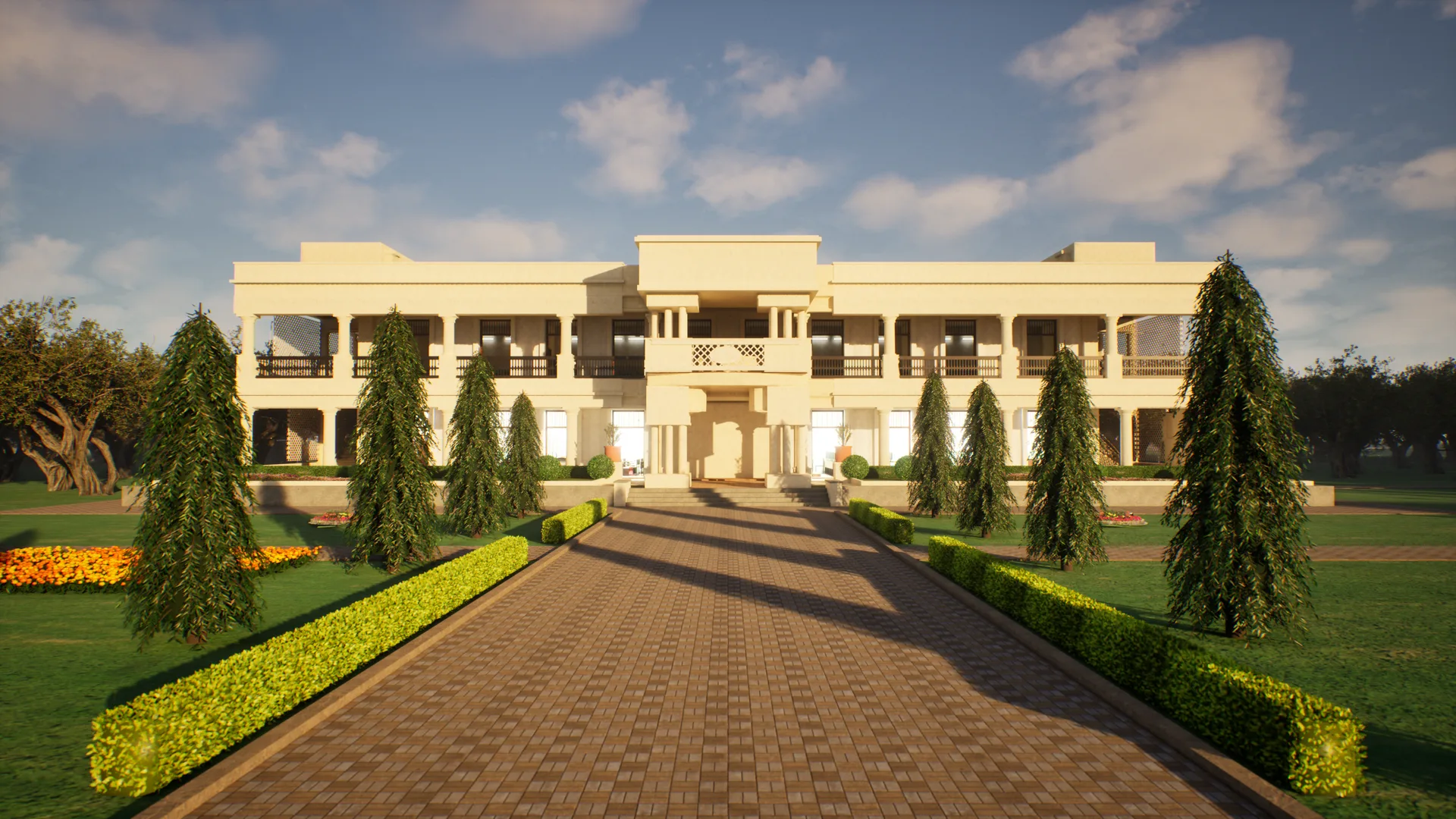 The front of the main building from the drive in the low evening sun, the portico in the middle, Ashoka trees either side casting long shadows